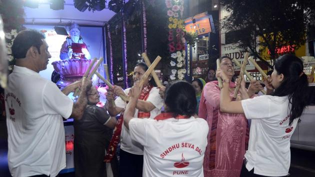 Families seen participating in a procession of Zulelal organised by Sindhi Seva Dal on the occasion of Sindhi New Year and Zulelal's birth anniversary on MG road in Pune.  (Ravindra joshi/ht photo ) 