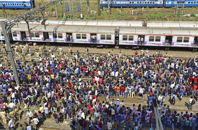Students of the All India Railway Act Apprentice Association stage a blockade demanding jobs in railway sector near Dadar and Matunga on the Central line in Mumbai. They blocked both the fast and slow Up and Down lines, disrupting local train schedules severely during morning rush hour and delaying outstation trains. (Vijayanand Gupta / HT Photo) Students of the All India Railway Act Apprentice Association stage a blockade demanding jobs in railway sector near Dadar and Matunga on the Central line in Mumbai. They blocked both the fast and slow Up and Down lines, disrupting local train schedules severely during morning rush hour and delaying outstation trains. (Vijayanand Gupta / HT Photo)