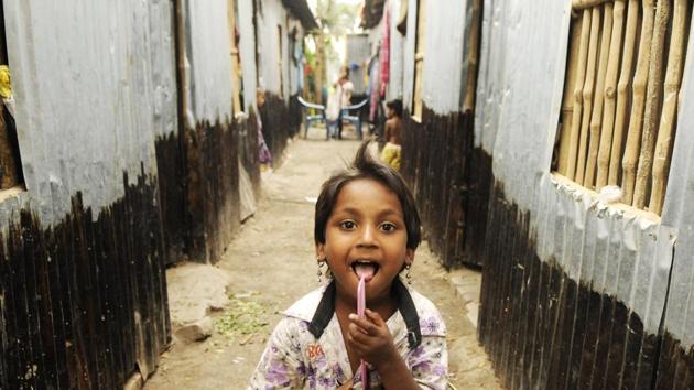 A Rohingya child poses in front of makeshift homes in Baruipur. The refugees had reason to feel less apprehensive about Bengal. Chief minister Mamata Banerjee has publicly criticised the Centre’s stand and expressed sympathies for the Rohingyas. “We do support the @UN appeal to help the Rohingya people. We believe that all commoners are not terrorists. We are really concerned,” Banerjee tweeted on September 15, 2017. (Samir Jana / HT Photo) A Rohingya child poses in front of makeshift homes in Baruipur. The refugees had reason to feel less apprehensive about Bengal. Chief minister Mamata Banerjee has publicly criticised the Centre’s stand and expressed sympathies for the Rohingyas. “We do support the @UN appeal to help the Rohingya people. We believe that all commoners are not terrorists. We are really concerned,” Banerjee tweeted on September 15, 2017. (Samir Jana / HT Photo)