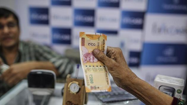 On Monday, the rupee slipped 23 paise to close at 65.17 against the dollar due to concerns over a widening current account deficit. (Dhiraj Singh/Bloomberg)