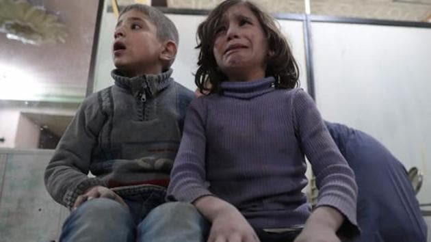 Syrian children wait to receive treatment at a makeshift clinic following reported air strikes by government forces in the rebel-held town of Douma, on the eastern outskirts of Damascus, on April 4, 2017. (AFP File Photo) Syrian children wait to receive treatment at a makeshift clinic following reported air strikes by government forces in the rebel-held town of Douma, on the eastern outskirts of Damascus, on April 4, 2017. (AFP File Photo)