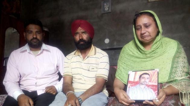 Wife Amarjeet Kaur and other family members of Gobinder Singh, a native of Murar village of Kapurthala district, mourn his death following confirmation by Sushma Swaraj that he had been killed in Iraq, on Tuesday. (HT Photo) Wife Amarjeet Kaur and other family members of Gobinder Singh, a native of Murar village of Kapurthala district, mourn his death following confirmation by Sushma Swaraj that he had been killed in Iraq, on Tuesday. (HT Photo)