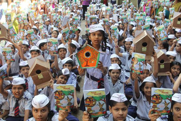 Students of Sankalp English School display the birdhouses they made and book featuring their poems.(Praful Gangurde)