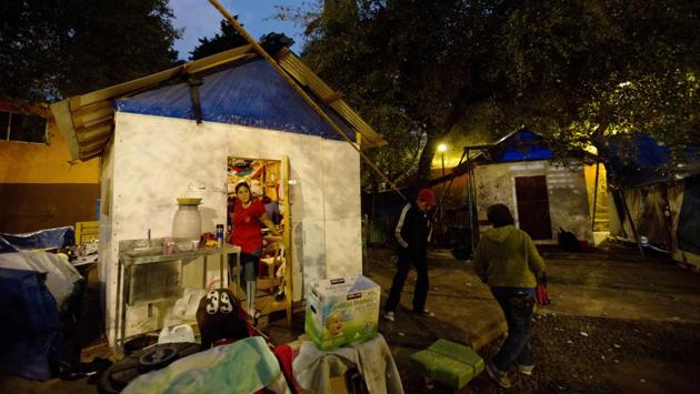 Residents chat outside a shelter in a park, six months after the September 19, 2017 earthquake damaged their housing complex leaving hundreds in housing limbo, waiting for damaged buildings to be either repaired or condemned, in Mexico City. Camps right by their damaged homes, erected by displaced residents are among the most visible signs that not everyone has moved on. (Rebecca Blackwell / AP)