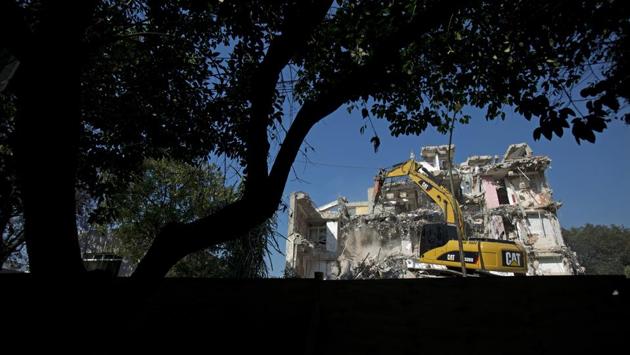 An eight-story apartment building is demolished at Toluca 43 in the Roma Sur neighbourhood of Mexico City. In a sense, those whose buildings collapsed totally were luckier; there is no dispute about demolition, and the government has offered self-financing in some cases to rebuild on existing lots, with developers selling off extra units to pay for reconstruction. (Rebecca Blackwell / AP)