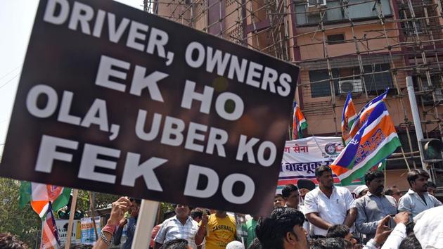 Ola and Uber drivers on Strike near OLA office at Andheri in Mumbai on March 19. Amidst the tussle between private drivers and the companies, citizens of Pune continue to suffer. Crowded places like the airport, railway stations, and colleges saw most of the impact of the strike on day two.(HT FILE PHOTO)