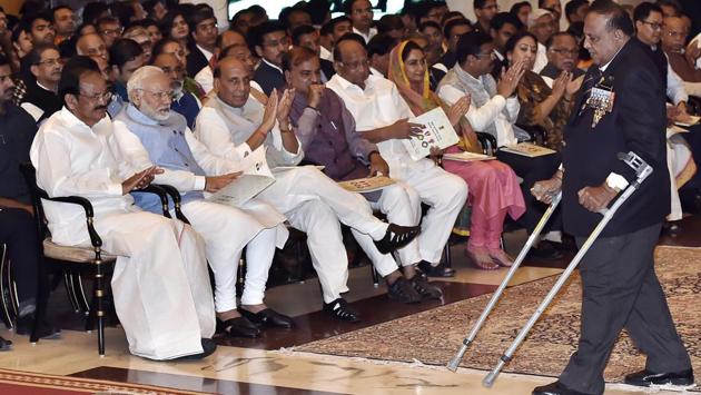 Vice President M. Venkaiah Naidu, Prime Minister Narendra Modi, Home Minister Rajnath Singh look on as Murlikant Rajaram Petkar India’s first Paralympic gold medalist walks to receive the Padma Shri. This year 85 recipients were selected including two duo cases. This included 3 Padma Vibhushan, 9 Padma Bhushan and 73 Padma Shri awardees. Fourteen of the awardees were women, while 16 were foreigners and three being awarded posthumously. (Ajay Aggarwal / HT Photo) Vice President M. Venkaiah Naidu, Prime Minister Narendra Modi, Home Minister Rajnath Singh look on as Murlikant Rajaram Petkar India’s first Paralympic gold medalist walks to receive the Padma Shri. This year 85 recipients were selected including two duo cases. This included 3 Padma Vibhushan, 9 Padma Bhushan and 73 Padma Shri awardees. Fourteen of the awardees were women, while 16 were foreigners and three being awarded posthumously. (Ajay Aggarwal / HT Photo)