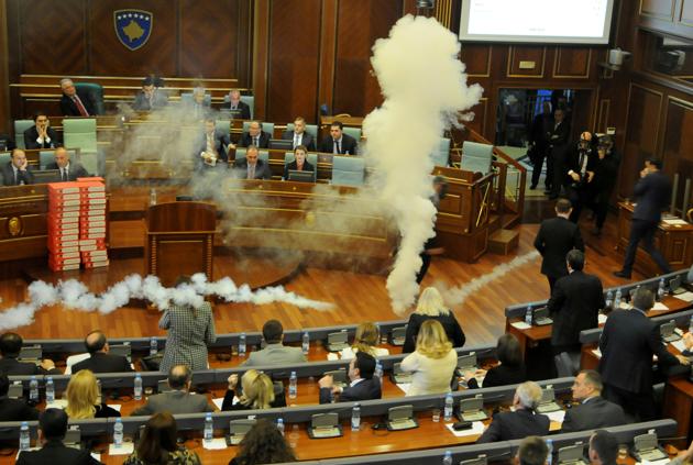 Kosovo opposition politicians release tear gas in Parliament on March 21, 2018. (Reuters) Kosovo opposition politicians release tear gas in Parliament on March 21, 2018. (Reuters)