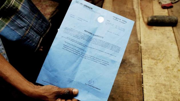 A refugee shows UNHCR certificates in Baruipur. When the police came the Rohingya did not have to feel alone as a number of local residents gathered and spoke in favour of them. “These people are helpless. Where will they go? It’s a question of humanity,” said Marzina Bibi, a resident of Hardaha. “No one leaves home with kids on an uncertain journey unless they have no other option.” (Samir Jana / HT Photo) A refugee shows UNHCR certificates in Baruipur. When the police came the Rohingya did not have to feel alone as a number of local residents gathered and spoke in favour of them. “These people are helpless. Where will they go? It’s a question of humanity,” said Marzina Bibi, a resident of Hardaha. “No one leaves home with kids on an uncertain journey unless they have no other option.” (Samir Jana / HT Photo)