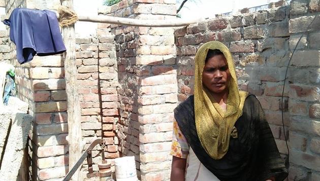 Kulwinder Kaur, a beneficiary, outside her under-construction toilet at a village in Muktsar on Wednesday. (HT Photo) Kulwinder Kaur, a beneficiary, outside her under-construction toilet at a village in Muktsar on Wednesday. (HT Photo)
