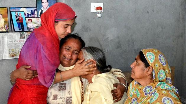 Harjit Kaur (L) with her mother-in-law Joginder Kaur (C) mourns the death of her husband Gurcharan Singh who was killed along with 39 Indians who went missing in Iraq in 2014, at Jalal Usma village near Amritsar on Tuesday. (Sameer Sehgal / HT Photo) Harjit Kaur (L) with her mother-in-law Joginder Kaur (C) mourns the death of her husband Gurcharan Singh who was killed along with 39 Indians who went missing in Iraq in 2014, at Jalal Usma village near Amritsar on Tuesday. (Sameer Sehgal / HT Photo)