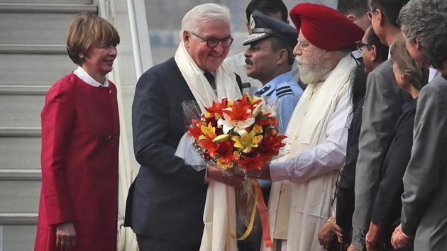 Indian Junior Minister for Drinking Water and Sanitation S.S. Ahluwalia, welcomes German President Frank Walter Steinmeier (2L) and his wife Elke Buedenbender upon their arrival at the Palam airport in New Delhi on Thursday. Steinmeier is on a four-day state visit to India. (Manish Swarup / AP) 