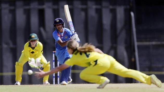 Indian player Harmanpreet Kaur bats against Australia during the Women's T20 Triangular Series in Mumbai on Thursday. (Rajanish Kakade / AP) 