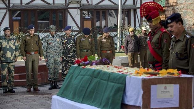 Police and paramilitary officers pay respects during the wreath laying ceremony of their colleague Deepak Thusoo, who was killed in a gun battle with suspected rebels, during a ceremony at the police headquarters in Srinagar on Thursday. (Dar Yasin / AP) Police and paramilitary officers pay respects during the wreath laying ceremony of their colleague Deepak Thusoo, who was killed in a gun battle with suspected rebels, during a ceremony at the police headquarters in Srinagar on Thursday. (Dar Yasin / AP)