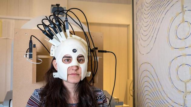 A handout photo released on March 21, 2018, via Nature from Wellcome shows a woman with the new brain scanner. (AFP PHOTO / NATURE / WELLCOME) A handout photo released on March 21, 2018, via Nature from Wellcome shows a woman with the new brain scanner. (AFP PHOTO / NATURE / WELLCOME)