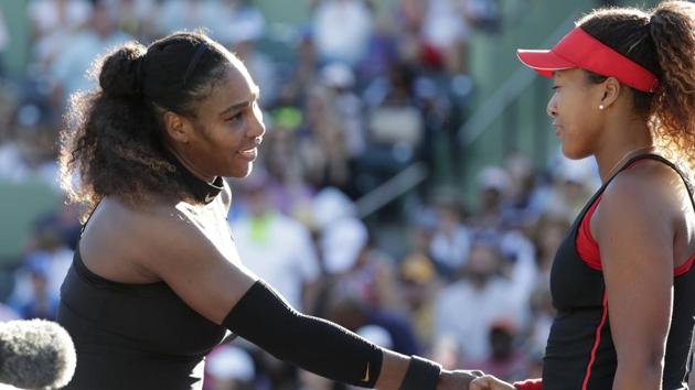 Naomi Osaka (right) shakes hands with Serena Williams after defeating her at the Miami Open on Wednesday.(AP)
