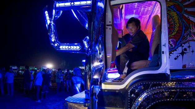 Like their South Asian peers, Thai truck owners are enthralled by decorous vehicles - with new designs spinning out across social media and the best artists charging up to US$1,600 for their work. “These trucks are used in real life,” said Teerasak Inklom, while controlling the state-of-the-art sound system on his heavily decorated 10-wheeler at the party in a disused field. (Lillian Suwanrumpha / AFP)