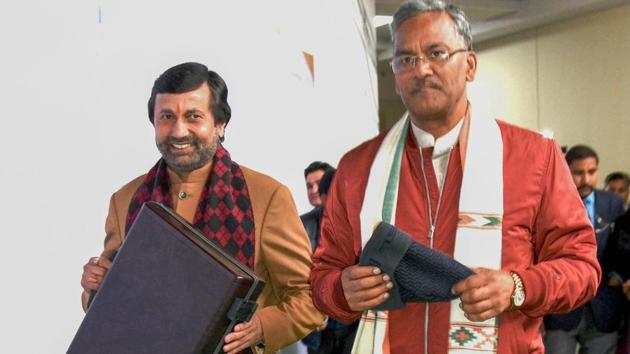 Chief minister Trivendra Singh Rawat (R) and finance minister Prakash Pant arrive to present the budget during the budget session of the state assembly on Thursday. (PTI) Chief minister Trivendra Singh Rawat (R) and finance minister Prakash Pant arrive to present the budget during the budget session of the state assembly on Thursday. (PTI)