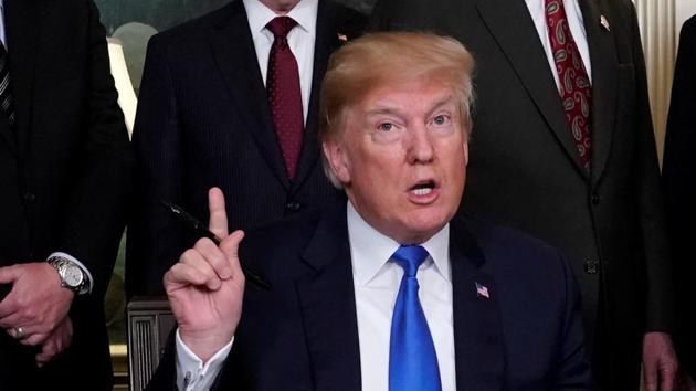 US president Donald Trump, surrounded by business leaders and administration officials, ahead of signing a memorandum on intellectual property tariffs on high-tech goods from China, at the White House in Washington, on March 22, 2018. (Reuters) US president Donald Trump, surrounded by business leaders and administration officials, ahead of signing a memorandum on intellectual property tariffs on high-tech goods from China, at the White House in Washington, on March 22, 2018. (Reuters)