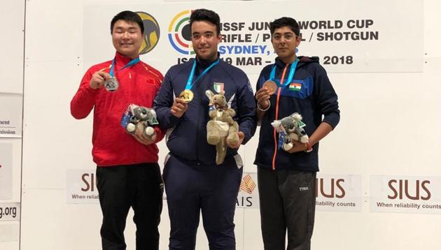 Vivaan Kapoor (right) on the podium after winning bronze medal in trap at junior shooting World Cup(ISSF)