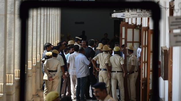 Police stand guard outside a polling booth during the Rajya Sabha election at Vidhan Soudha in Bengaluru on March 23, 2018.(Arijit Sen/HT Photo) Police stand guard outside a polling booth during the Rajya Sabha election at Vidhan Soudha in Bengaluru on March 23, 2018.(Arijit Sen/HT Photo)