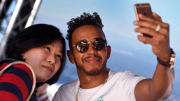 Mercedes' British driver Lewis Hamilton greets his fans ahead of the Formula One Australian Grand Prix in Melbourne. (AFP) Mercedes' British driver Lewis Hamilton greets his fans ahead of the Formula One Australian Grand Prix in Melbourne. (AFP)
