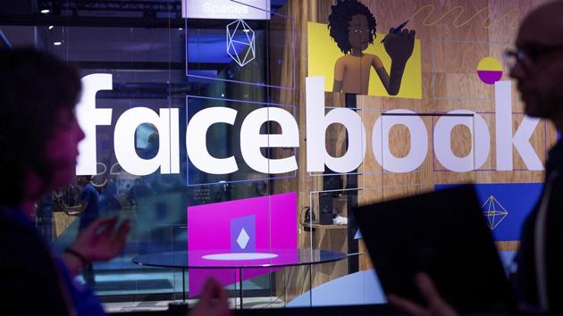 In this April 18, 2017, file photo, people speak in front of a demo booth at Facebook's annual F8 developer conference, in San Jose, California.(AP)