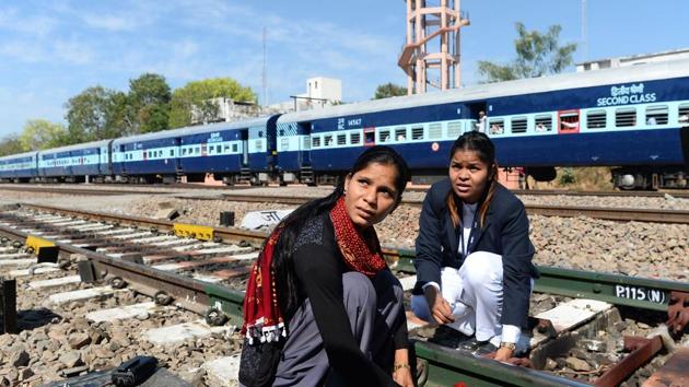Neelam Jatav (right) with a colleague working on a railway track at the Gandhinagar railway station in Jaipur. Gandhinagar is India's only interstate train station run entirely by women. India is one of the world's fastest growing major economies but also has one of the lowest rates of female employment, and the trend is worsening.(AFP)