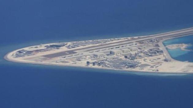 An airstrip, structures and buildings on China's man-made Subi Reef in the Spratly chain of islands in the South China Sea are seen from a Philippine Air Force C-130 transport plane of the Philippine Air Force.(AP File Photo)
