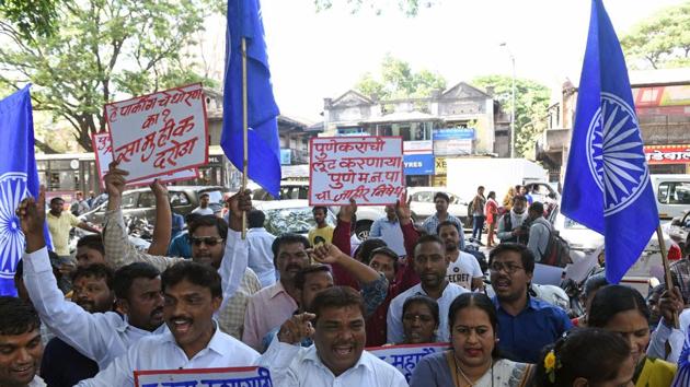 Members of Bhim Army stage a protest at the PMC gate on Friday against the proposed parking policy. The day was marked by protests by multiple political parties against the policy. (Pratham Gokhale/HT Photo)