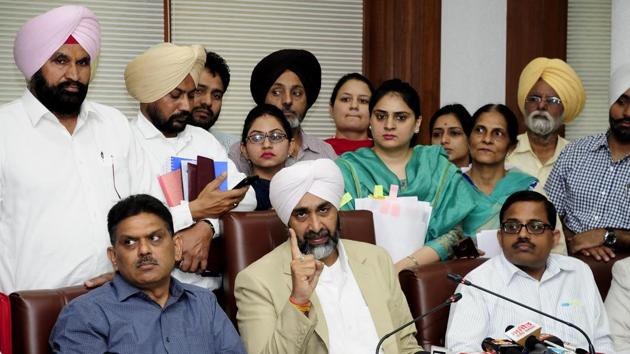 Punjab finance minister Manpreet Singh Badal along with officials during the press conference after presentation of annual budget at Vidhan Sabha in Chandigarh on Saturday. (Keshav Singh/HT) Punjab finance minister Manpreet Singh Badal along with officials during the press conference after presentation of annual budget at Vidhan Sabha in Chandigarh on Saturday. (Keshav Singh/HT)