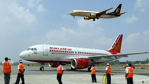 This photo taken on October 15, 2008, shows ground crew standing next to a newly-inducted Air India Airbus A319 aircraft during the opening day of India Aviation 2008 at Begumpet Airport in Hyderabad. (AFP) This photo taken on October 15, 2008, shows ground crew standing next to a newly-inducted Air India Airbus A319 aircraft during the opening day of India Aviation 2008 at Begumpet Airport in Hyderabad. (AFP)