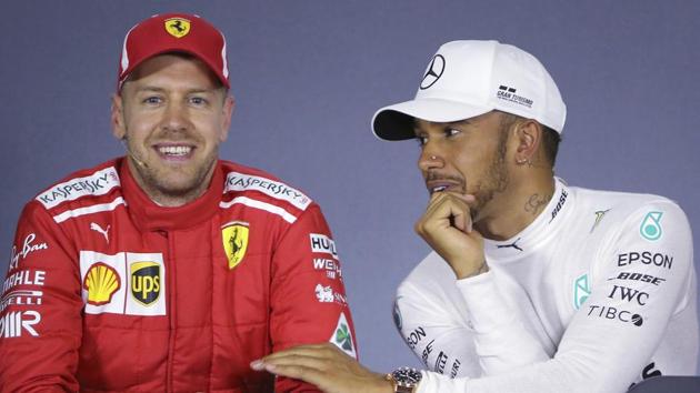 Mercedes driver Lewis Hamilton, right, of Britain, and Ferrari driver Sebastian Vettel of Germany share a light moment during a press conference following qualifying at the Australian Formula One Grand Prix in Melbourne, Saturday (March 24).(AP)