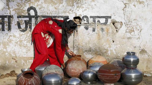 A girl collects drinking water from a tap in a village in Rajasthan.(AFP file photo)
