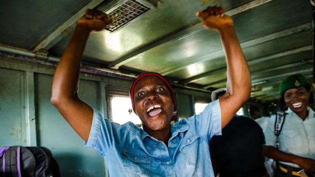 A female prisoner celebrates with songs in the back of a prison’s truck as she was released from the Chikurubi Prison, in Harare, Zimbabwe on March 22, 2018. Zimbabwean President Emmerson Mnangagwa, who succeeded ousted Robert Mugabe in November 2017, has pardoned at least 3,000 prisoners to clear out overpopulated jails of the country. (Jekesai Njikizana / AFP)