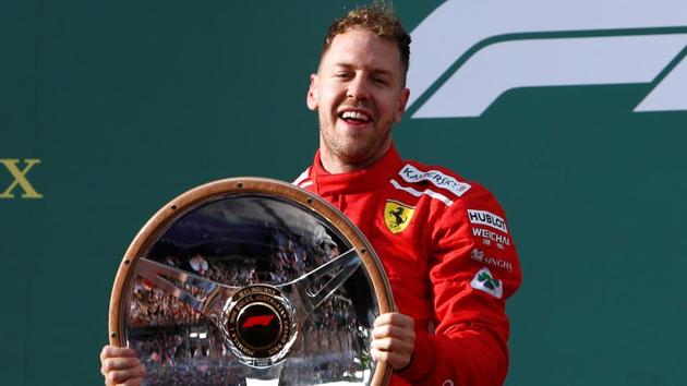 Ferrari's Sebastian Vettel celebrates his Formula 1 Australian Grand Prix win in Melbourne on Sunday.(Reuters)