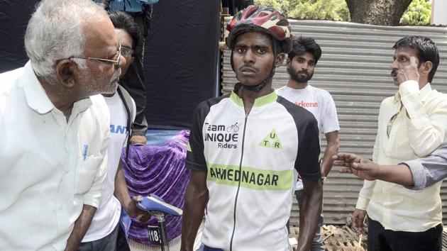 Sambhaji Mohite fell down on JM road after chaos at the Mumbai - Pune Cycle Race finish point in Pune.(RAVINDRA JOSHI/HT PHOTO)
