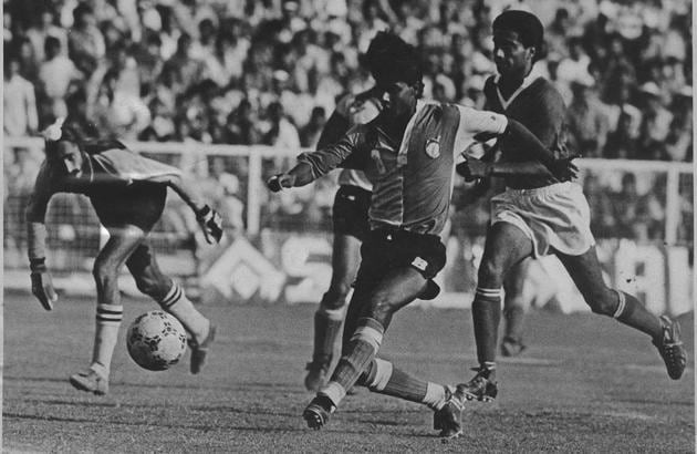 November 10, 1993: East Bengal striker Sanjay Majhi drills in a left-footer beyond Punjab State Electricity Board goalkeeper Balwinder Singh Binda for the winner as defender HP Singh (left) watches helplessly in the Durand cup football final in New Delhi. East Bengal won-1-0 lift the trophy for the 11th time.(HT file photo)