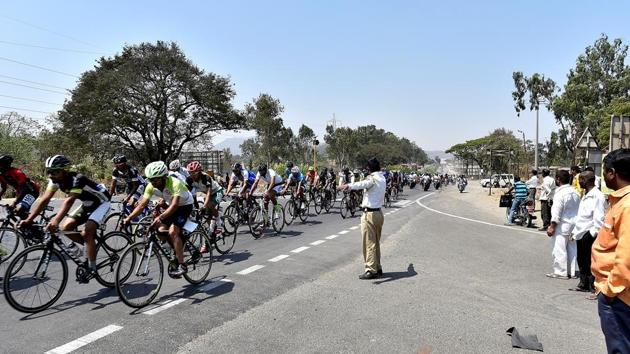 The race, organised by Cycling Association of Maharashtra and Kreeda Jagruti Sports Pvt. Ltd.  with support from Giant Starkenn, finished opposite Sambhaji Garden on the arterial Jangli Maharaj Road in Pune, where there was a lot of traffic, which threw the last leg of the race into chaos.   (Anshuman Poyrekar/HT Photo) 