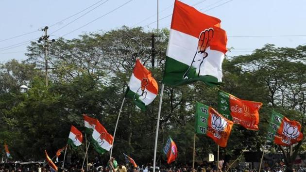 Congress and BJP supporters wave flags in a show of strength in Indore. (HT File Photo) Congress and BJP supporters wave flags in a show of strength in Indore. (HT File Photo)