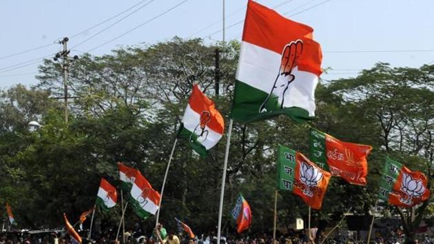 Congress and BJP supporters wave flags in a show of strength in Indore. (HT File Photo) Congress and BJP supporters wave flags in a show of strength in Indore. (HT File Photo)