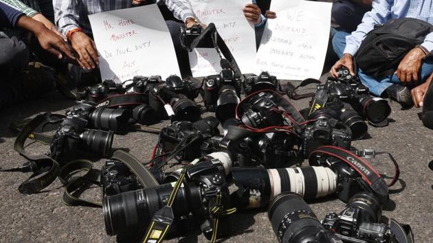 Journalists and photographers put their cameras down during a protest march from Press Club of India to Parliament House against the assault on journalists during the recent JNU students protests in New Delhi. (Raj K Raj / HT Photo) Journalists and photographers put their cameras down during a protest march from Press Club of India to Parliament House against the assault on journalists during the recent JNU students protests in New Delhi. (Raj K Raj / HT Photo)