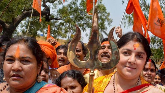 West Bengal Bharatiya Janata Party Mahila Morcha chief Locket Chatterjee holds a trishul during a religious procession to celebrate Ram Navami in Birbhum on Sunday. (PTI Photo) West Bengal Bharatiya Janata Party Mahila Morcha chief Locket Chatterjee holds a trishul during a religious procession to celebrate Ram Navami in Birbhum on Sunday. (PTI Photo)