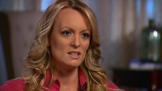 Stormy Daniels, an adult film star and director whose real name is Stephanie Clifford is interviewed by Anderson Cooper of CBS News' 60 Minutes program in early March 2018, in a still image from video provided March 25, 2018.(REUTERS) Stormy Daniels, an adult film star and director whose real name is Stephanie Clifford is interviewed by Anderson Cooper of CBS News' 60 Minutes program in early March 2018, in a still image from video provided March 25, 2018.(REUTERS)