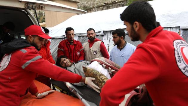 Syrian paramedics carry an injured man upon his arrival to Qalaat al-Madiq after being evacuated. More than 1,600 civilians have died since the Ghouta assault began on February 18, says the Syrian Observatory for Human Rights. Syria’s government has used siege tactics followed by heavy bombardment and negotiated settlements to recapture swathes lost to rebels. (Omar Haj Kadour / AFP) Syrian paramedics carry an injured man upon his arrival to Qalaat al-Madiq after being evacuated. More than 1,600 civilians have died since the Ghouta assault began on February 18, says the Syrian Observatory for Human Rights. Syria’s government has used siege tactics followed by heavy bombardment and negotiated settlements to recapture swathes lost to rebels. (Omar Haj Kadour / AFP)