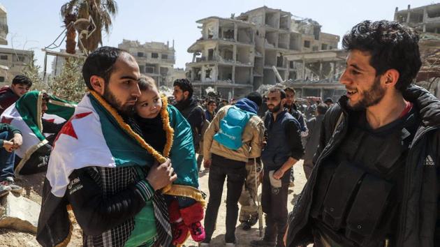 The deal with Faylaq al-Rahman, brokered by Russia and announced on Friday, provides for the evacuation of 7,000 rebels and civilians from the pocket of Ghouta it controlled. The deal also offered residents the option to stay as Ghouta fell to the regime. (Amer Almohibany / AFP) The deal with Faylaq al-Rahman, brokered by Russia and announced on Friday, provides for the evacuation of 7,000 rebels and civilians from the pocket of Ghouta it controlled. The deal also offered residents the option to stay as Ghouta fell to the regime. (Amer Almohibany / AFP)