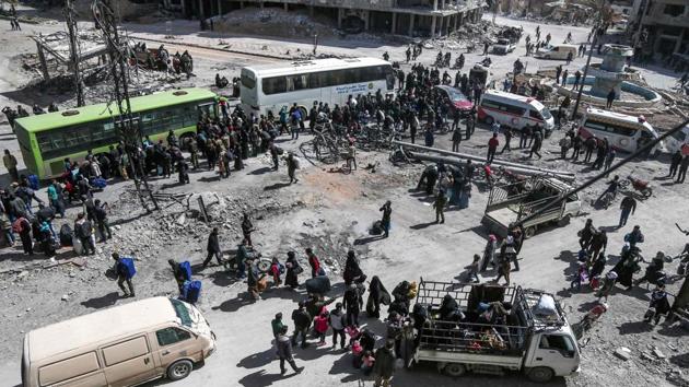 More than 5,000 Syrian rebels and civilians left a ravaged pocket of Eastern Ghouta, Syria on Sunday, in fresh evacuations that further emptied the former rebel bastion. Five weeks since the Syrian regime launched an all-out assault on Ghouta, it holds more than 90% of the onetime opposition stronghold on the edge of Damascus. (Abdulmonan Eassa / AFP) More than 5,000 Syrian rebels and civilians left a ravaged pocket of Eastern Ghouta, Syria on Sunday, in fresh evacuations that further emptied the former rebel bastion. Five weeks since the Syrian regime launched an all-out assault on Ghouta, it holds more than 90% of the onetime opposition stronghold on the edge of Damascus. (Abdulmonan Eassa / AFP)