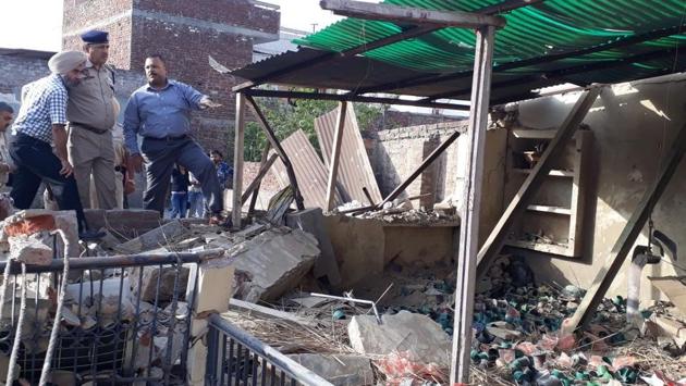 Jalandhar police commissioner PK Sinha and other officials inspect a residence after a blast occurred here in the central town area of Jalandhar. Two people were injured in the explosion. (Pradeep Pnadit / HT Photo) Jalandhar police commissioner PK Sinha and other officials inspect a residence after a blast occurred here in the central town area of Jalandhar. Two people were injured in the explosion. (Pradeep Pnadit / HT Photo)