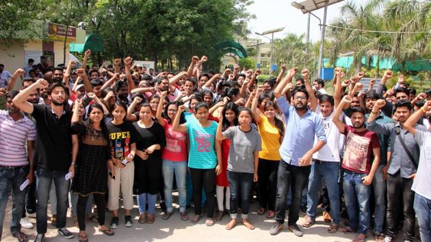 Students of Central University of Punjab, Bathinda against an associate professor for allegedly casting aspersions on the character of a girl student of the campus, on Tuesday.(Sanjeev Kumar/HT)