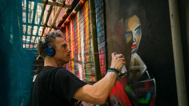 While artists like Kitchener express themselves on the city’s streets drawn by Hong Kong’s unique geography and energy, the commercial high end of the art world is at the fore in March, with gallerists, collectors and celebrities descending on Hong Kong for the annual Art Basel fair which runs for five days at the harbor-front convention center. (Anthony Wallace / AFP) 